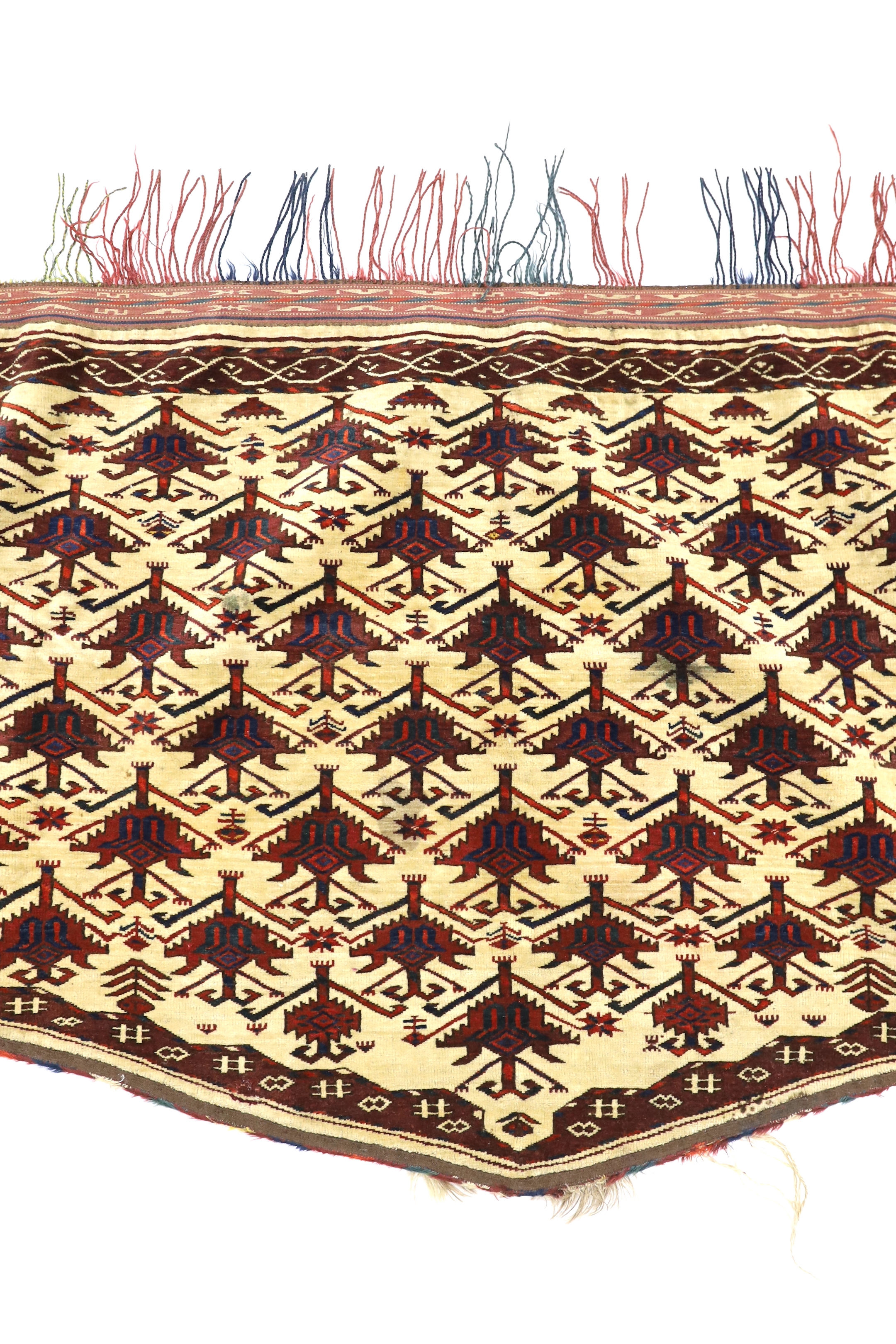 An antique Afghan arched panel woven with rows of stepped decoration on an ivory ground, width 150cm, depth 83cm